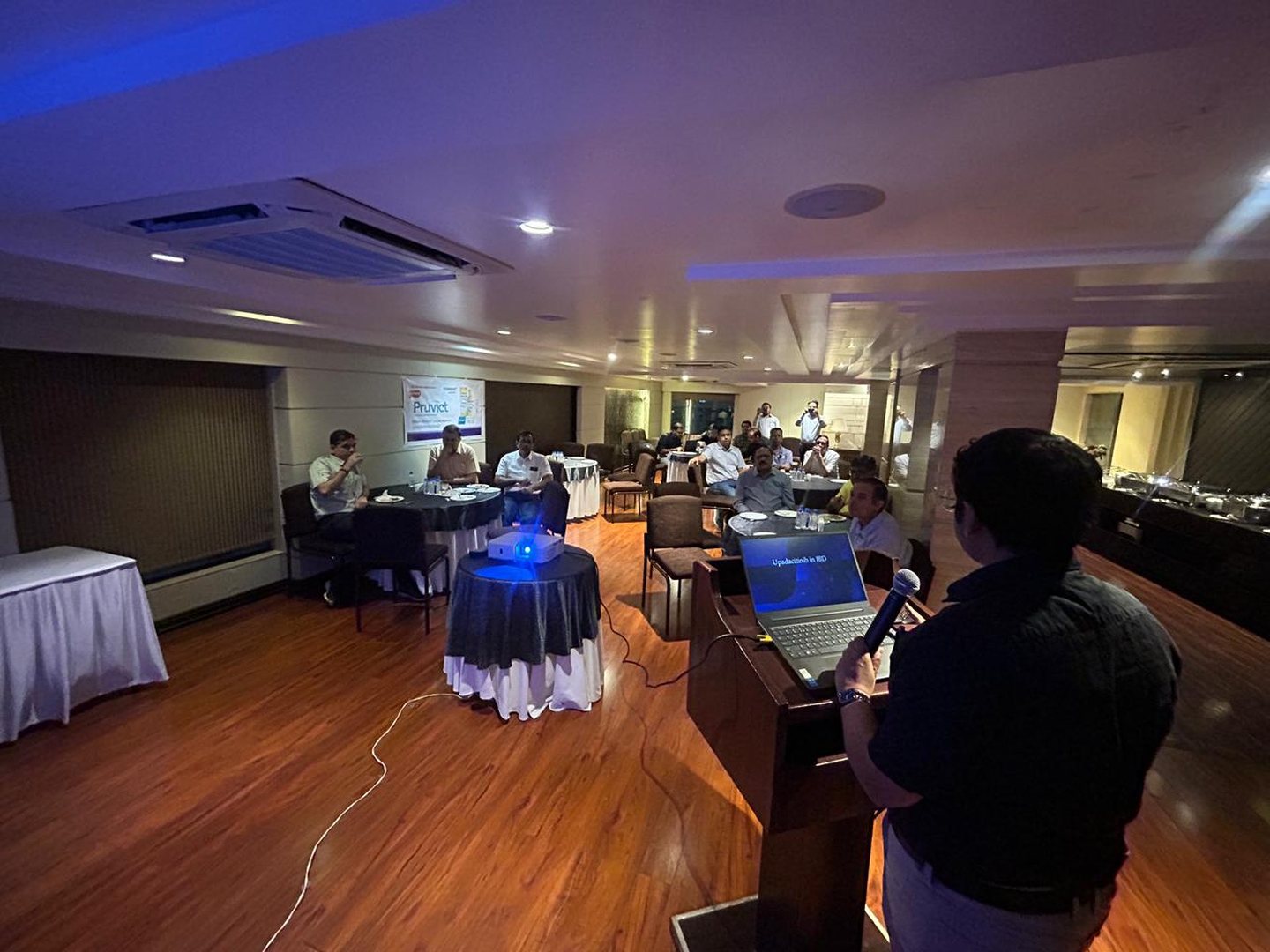 A speaker presenting to gastroenterologists during a Gastroenterology Club of Indore academic meeting